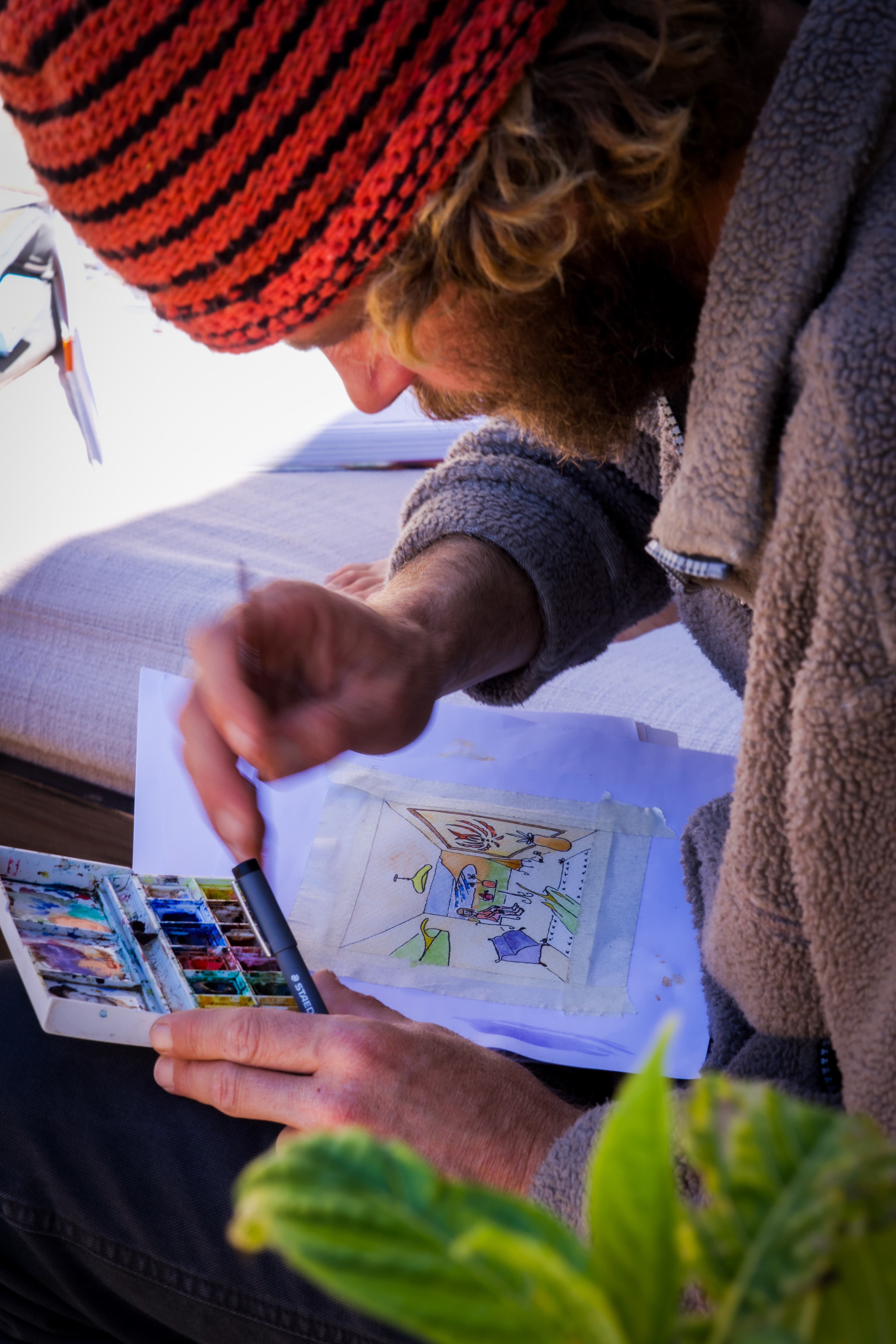 Omer painting a watercolour study on the terrace