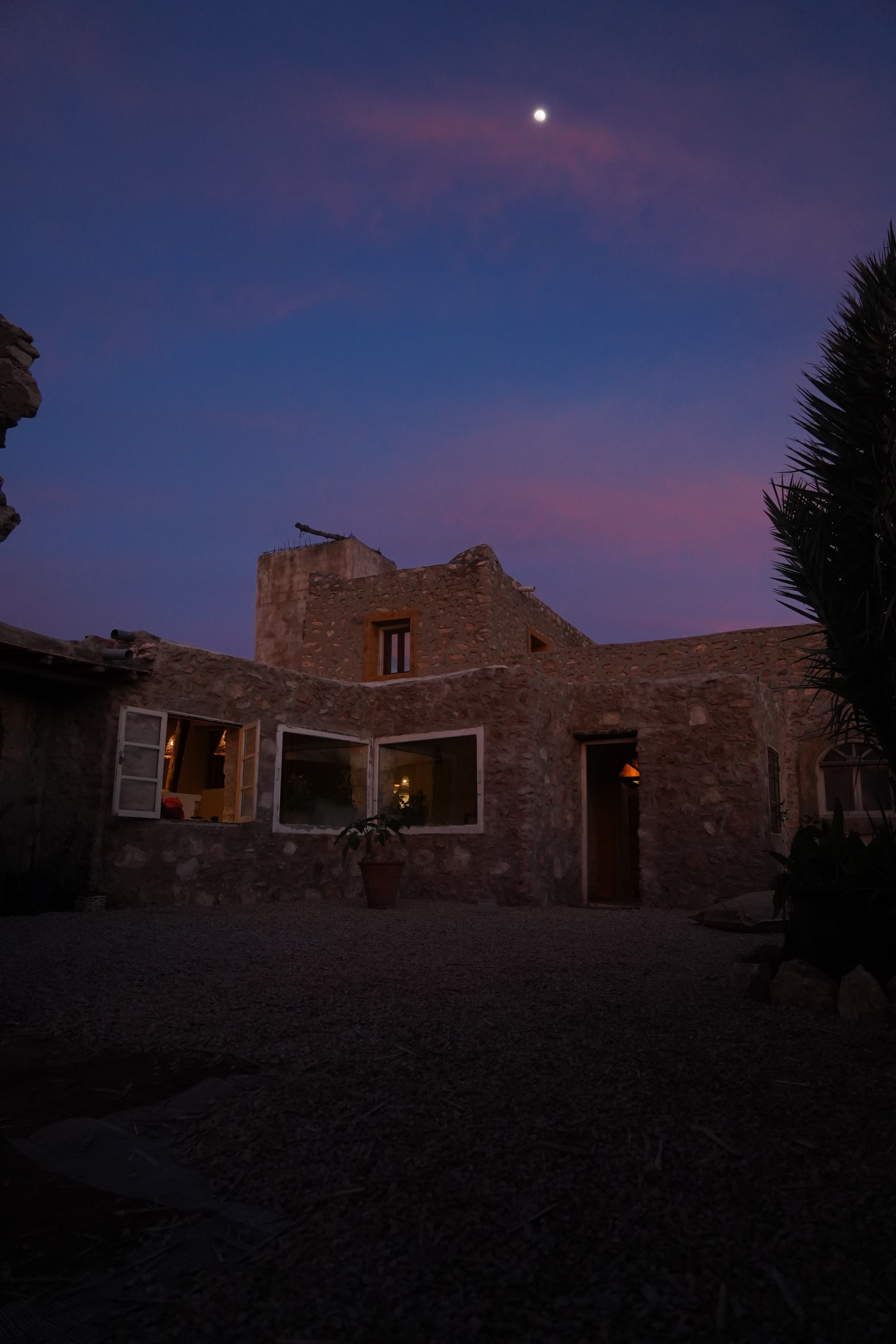 The Template house lit up at night